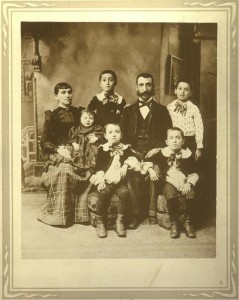 Sarah Gitel Frank holding baby- possibly Theodore? Son Philip standing to the right of her, husband John sitting. The other 3 boys are probably Joseph standing, Louis in center, and Max sitting on right.