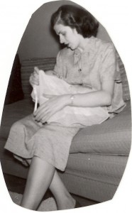 Mary (Helbling) McMurray holding their first child, 1954.