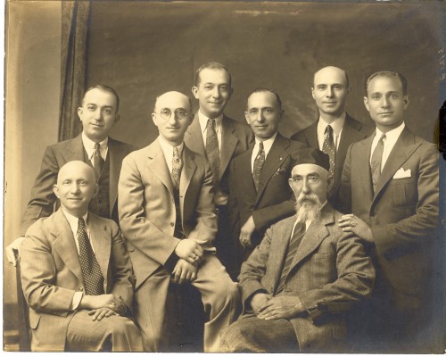 John Jacob/Zelig Broida and his seven sons. From left- front sitting- Max Broida, standing- Phillip Broida, Joseph J. Broida, Morris Broida, Louis Broida, Theodore Broida, Harold Broida. Sitting on right- John J. "Zelig" Broida.