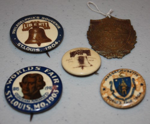 Souvenirs of 1904 St. Louis World's Fair- 4 pins plus watch fob/medal.